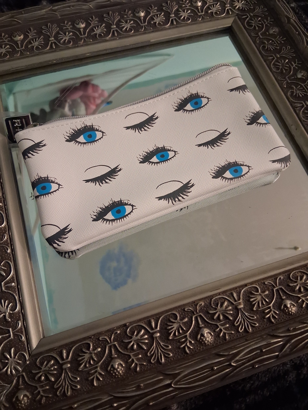 Rodan + Fields White Cosmetic Pouch with Blue Eye Motif